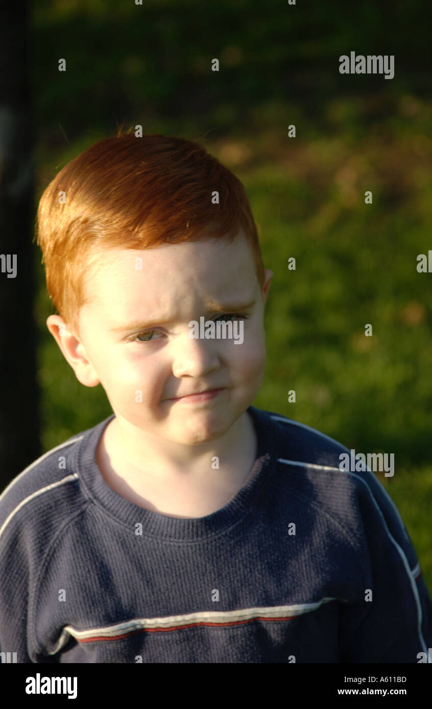 Red haired boy with different facial expressions Stock Photo