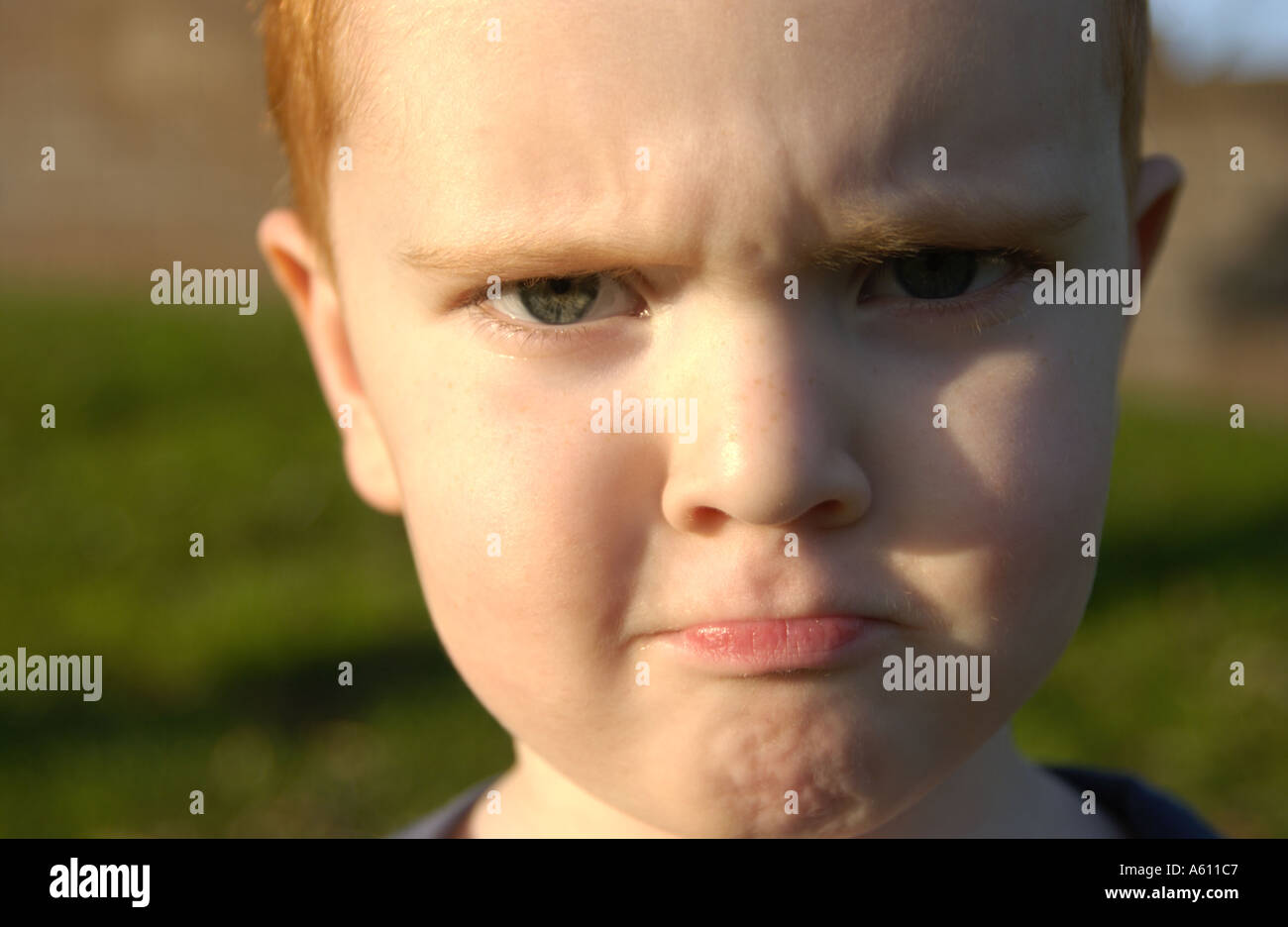 Red haired boy with different facial expressions Stock Photo