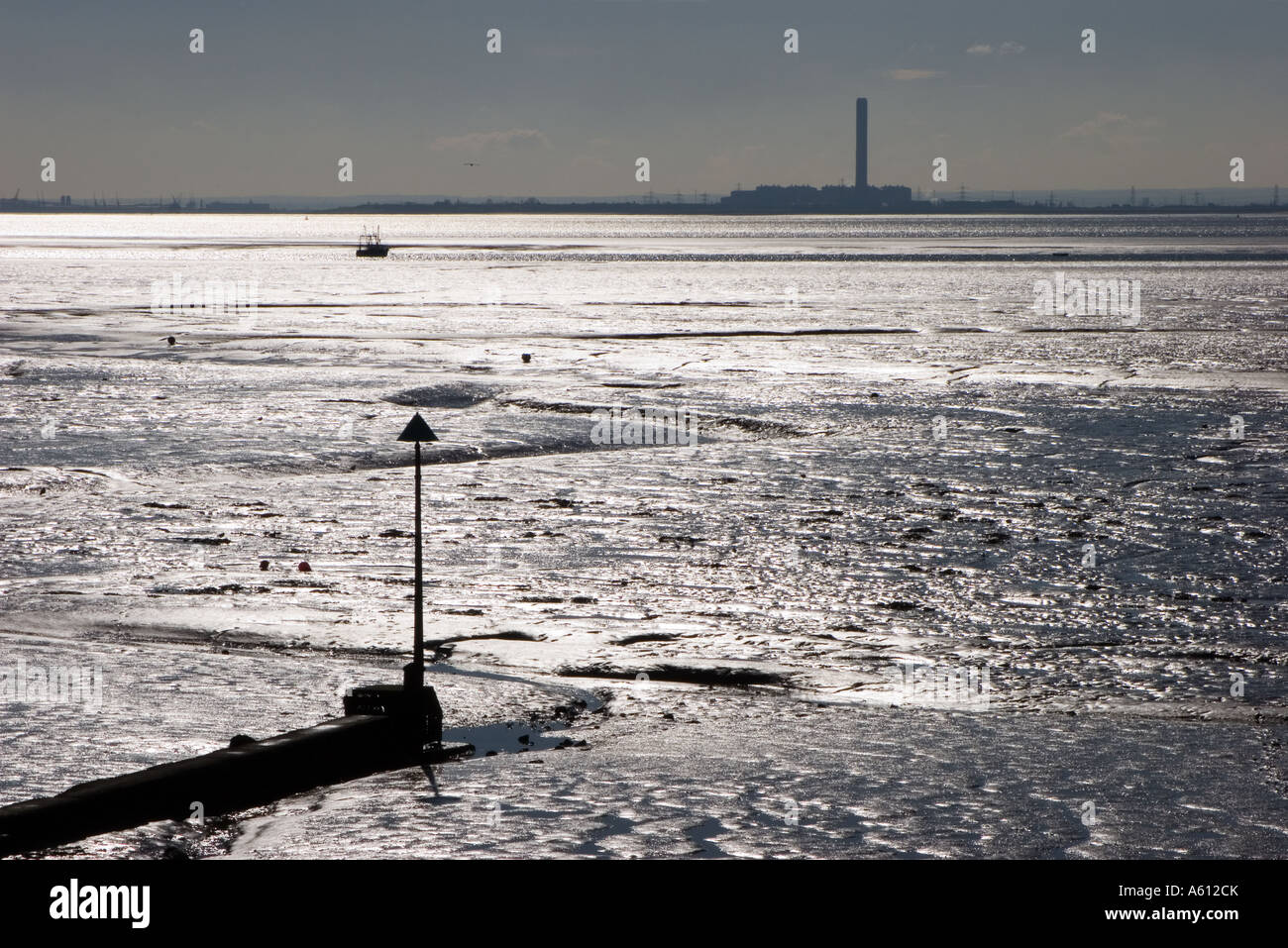 Low winter sun glinting off the mud flats and sea in the Thames estuary between Leigh on Sea and