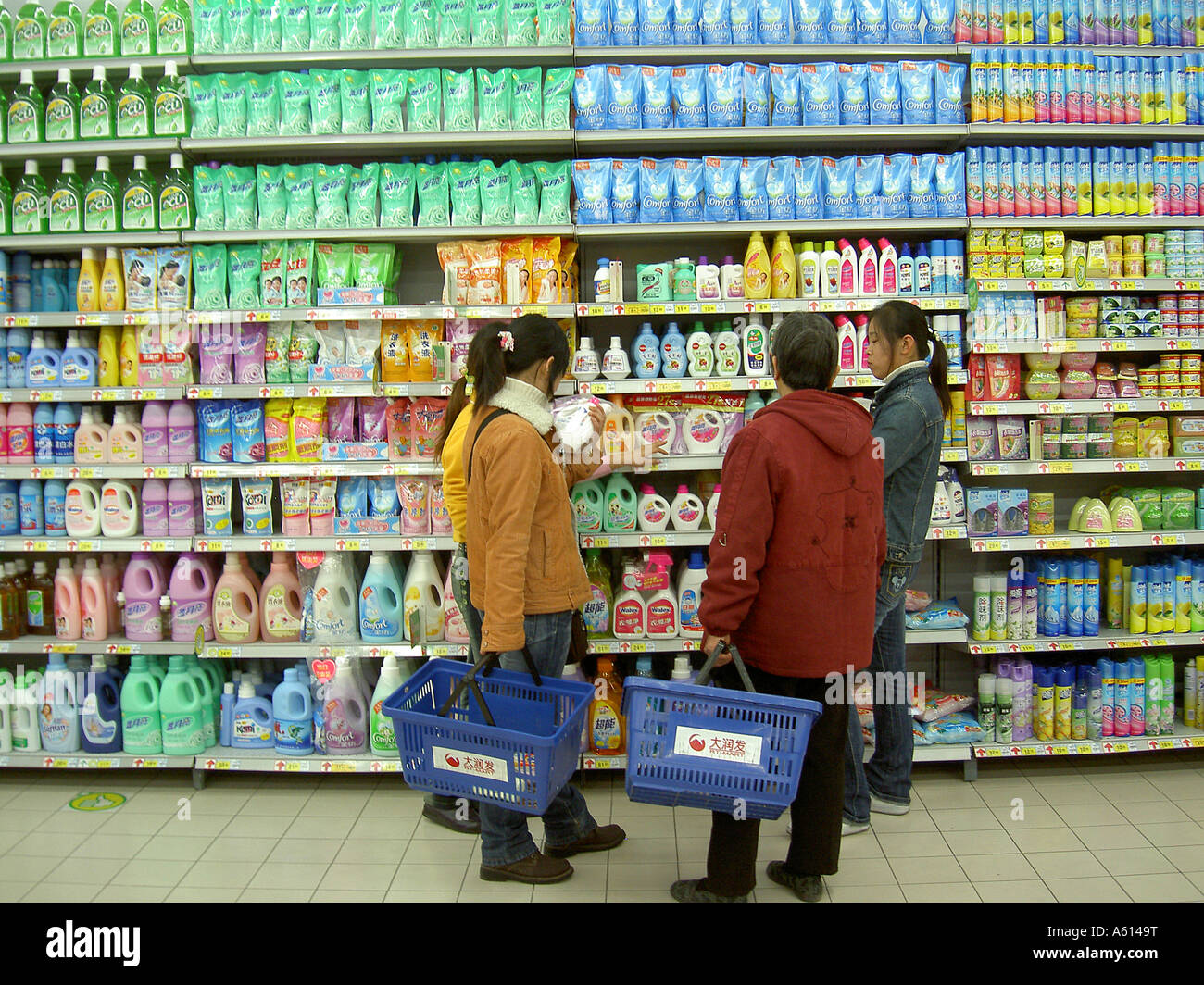 Taiwanese KT Mart store in city of Jinan, Shandong Province, China. Supermarket interior aisle shoppers buying detergent product Stock Photo