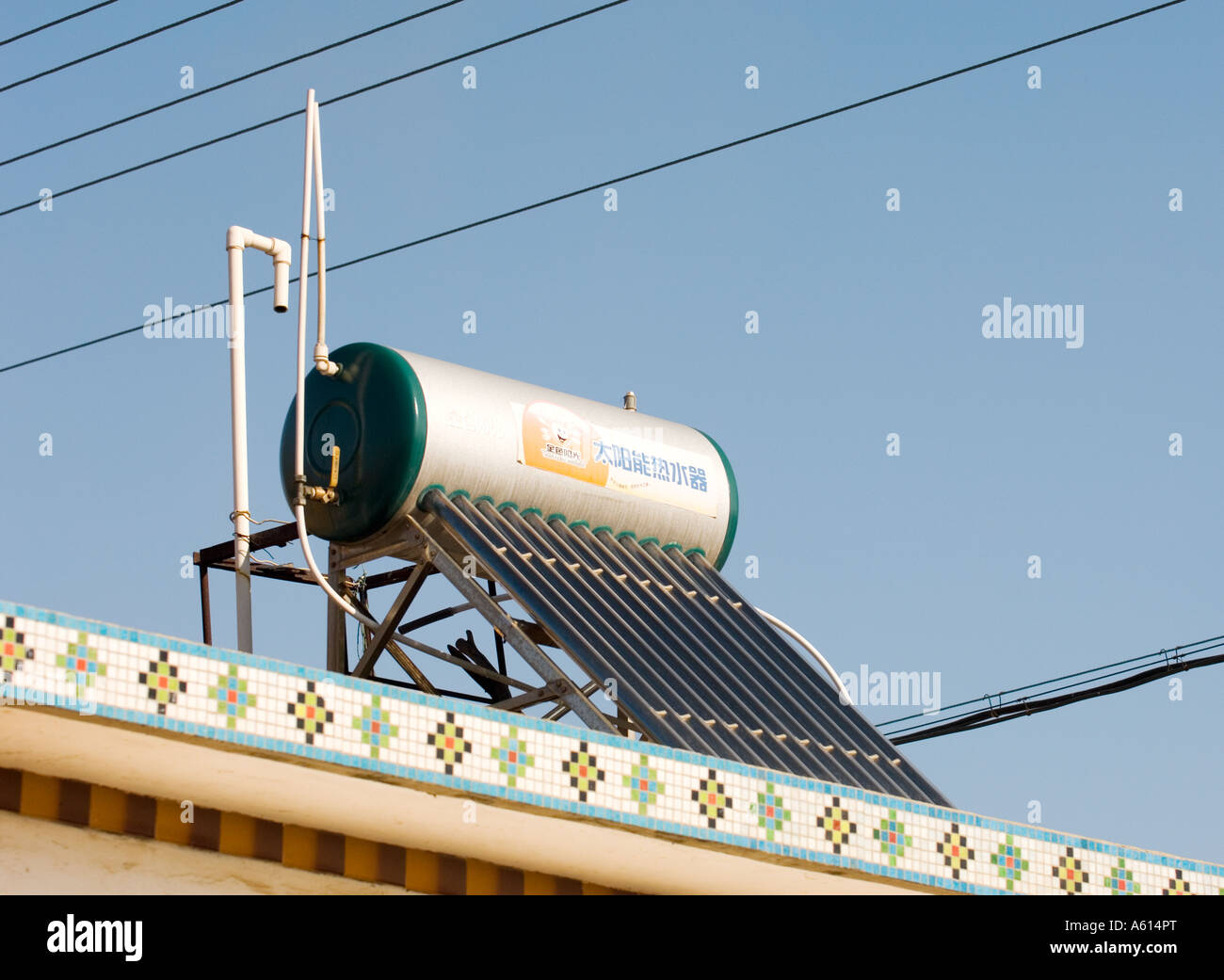 https://c8.alamy.com/comp/A614PT/solar-power-powered-hot-water-heater-tank-on-house-roof-in-rural-farming-A614PT.jpg