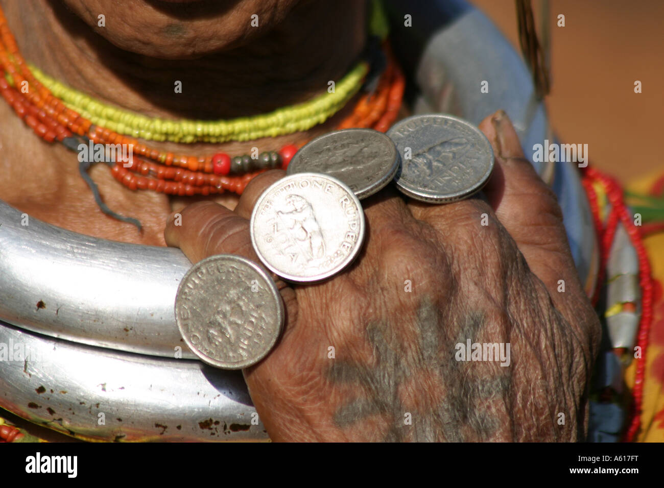 Gadaba tribal woman wearing rings made up of coins celebrating the year of Indian independence  1947 for India Stock Photo