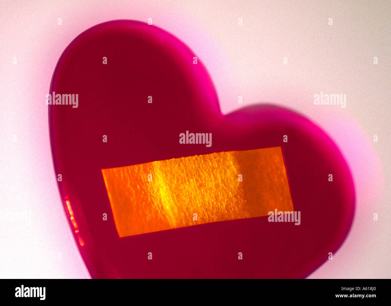 Close-up of heart and bandage Stock Photo