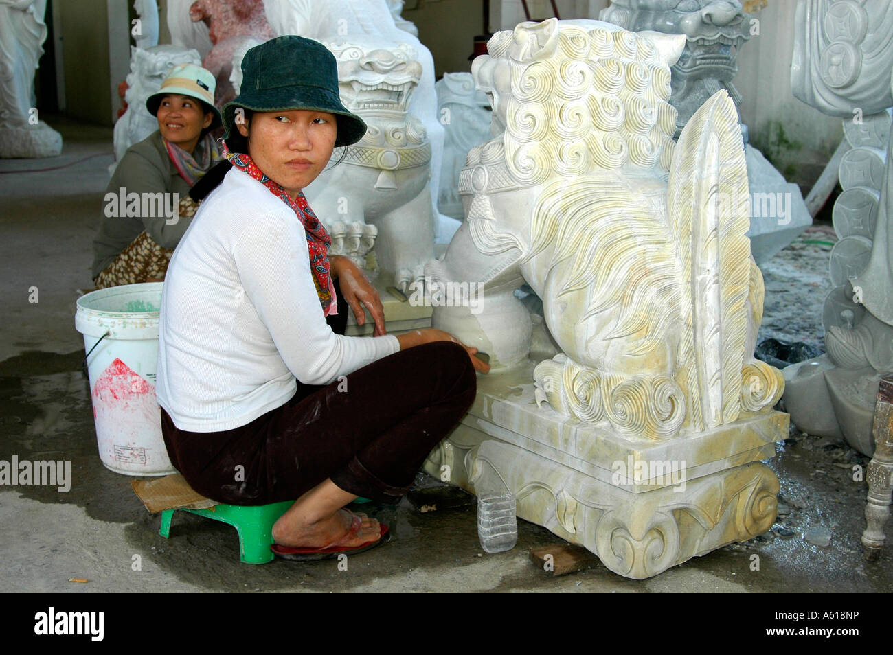 Craftsperson in a marble carving manufacture, Marble Mountains near Danang, Vietnam Stock Photo