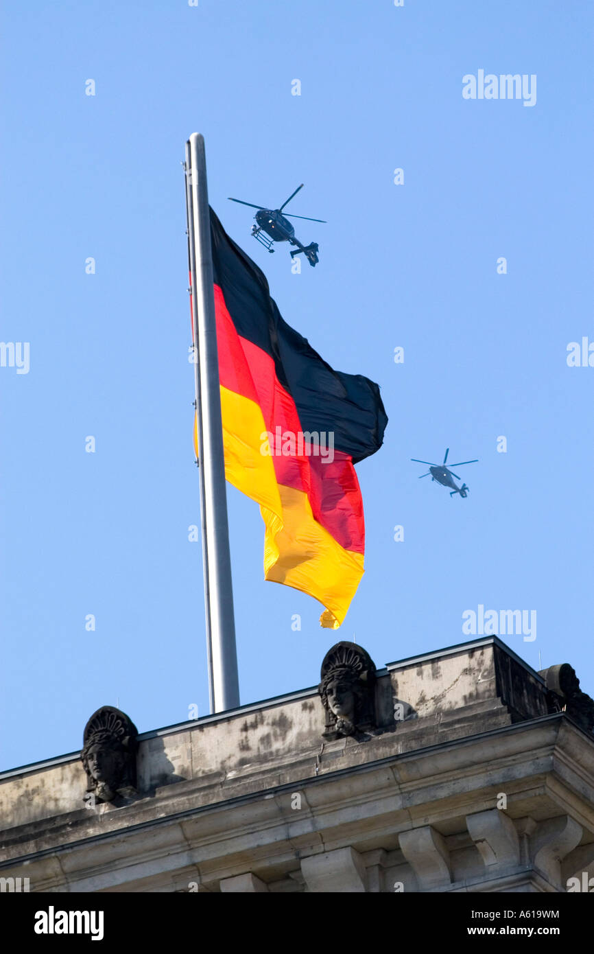 German flag with two helicopters, Reichstag, Berlin, Germany Stock Photo