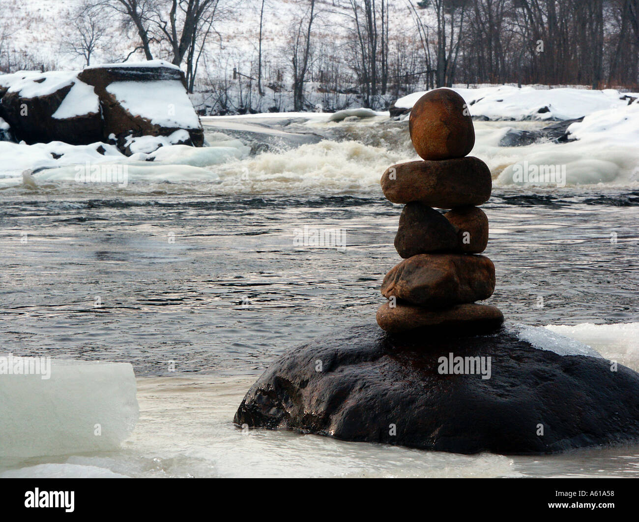 Inuksuk overlooking the Riviere Rouge in the Outaouais region Quebec Canada Stock Photo