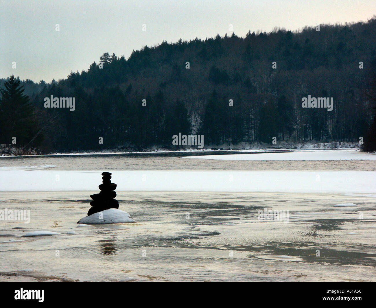 Small inuksuk overlooking the Riviere Rouge in the Outaouais region Quebec Canada Stock Photo