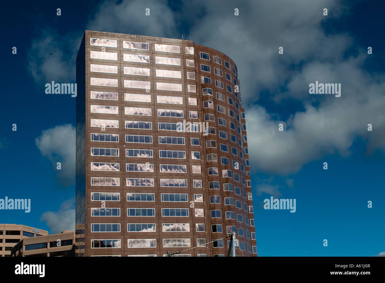 Office building against blue sky Stock Photo - Alamy