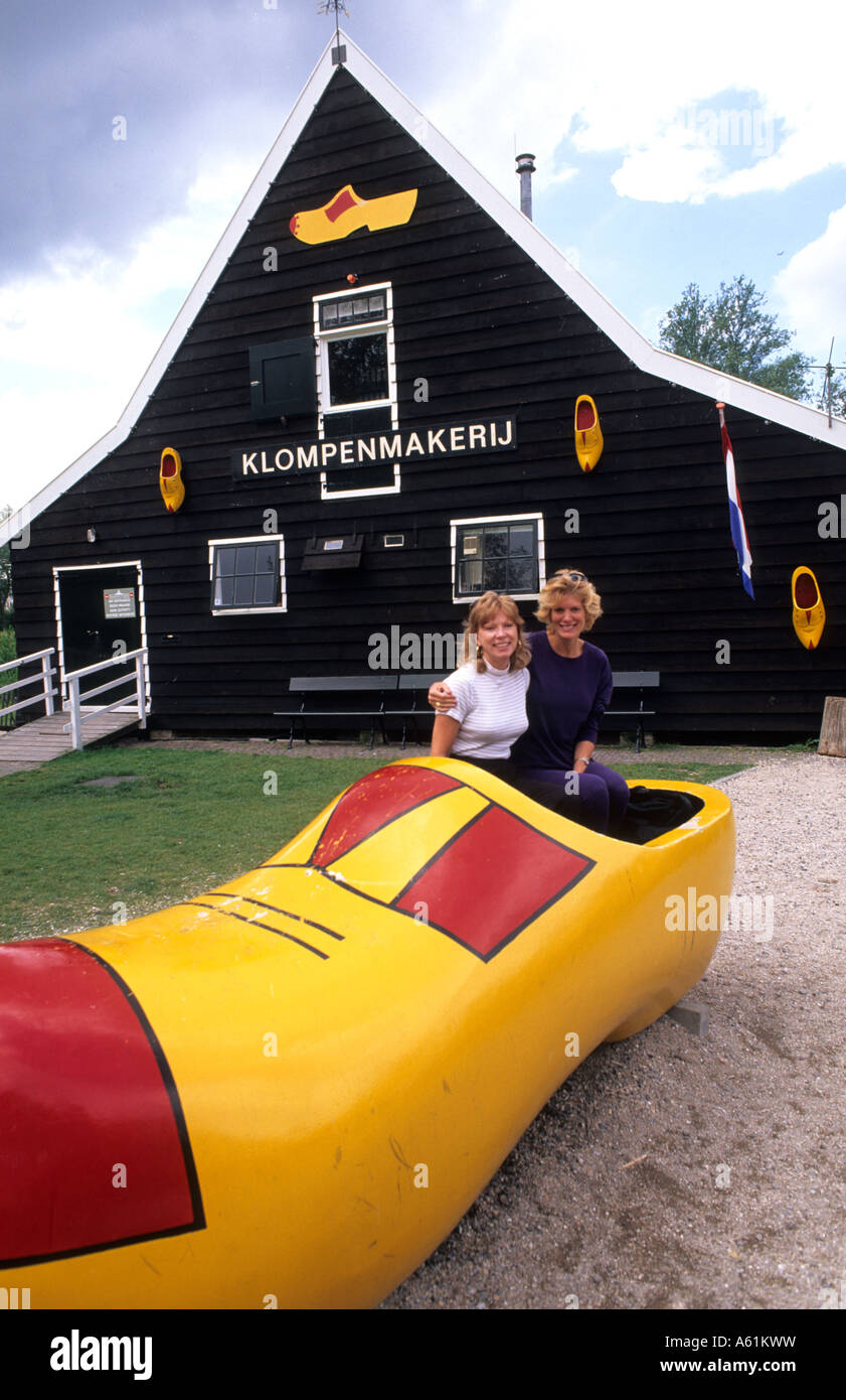 Women tourists at Cheese Factory with giabt clog shoe in Volendam