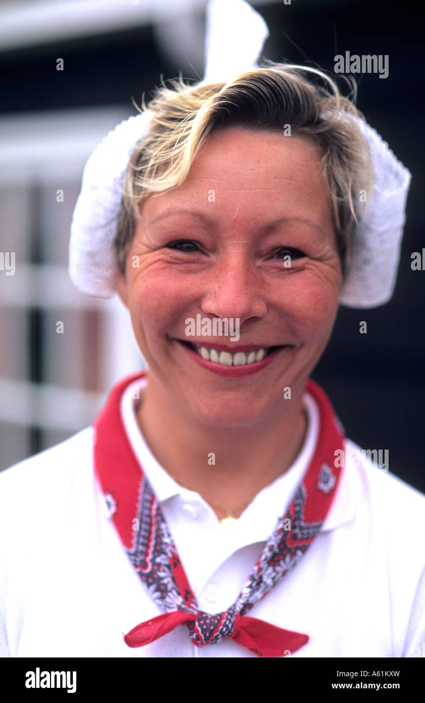 Dutch historical costumed woman at Cheese factory in Volendam Holland