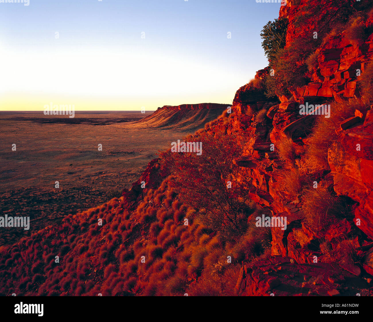 Red sunset light on the western escarpment of the Breadon Hills on the Canning Stock Route Great Sandy Desert Western Australia Stock Photo
