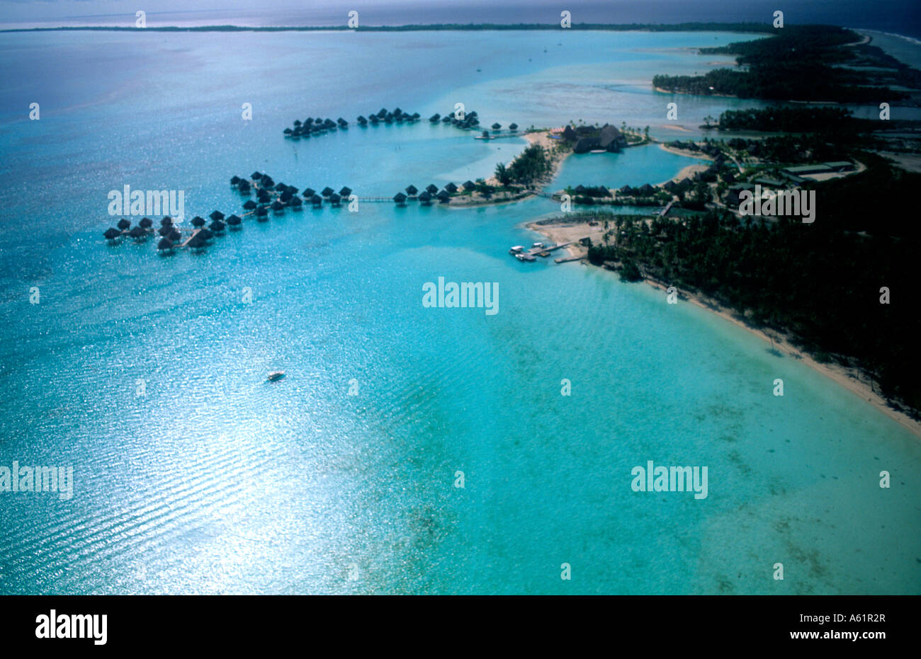 Aerial of the green water and clear blue colors of the islands of Bora