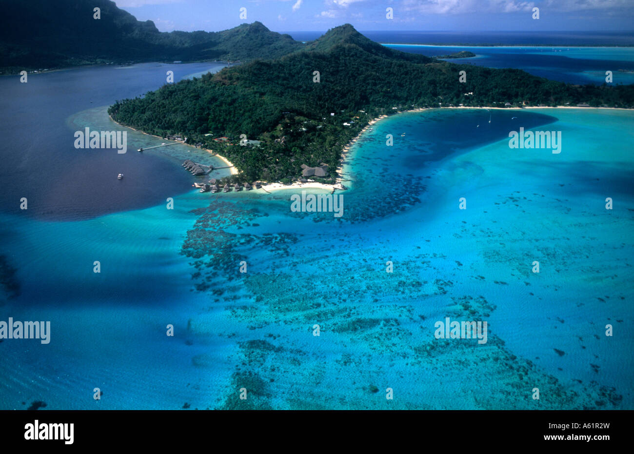 Aerial of the green water and clear blue colors of the islands of Bora