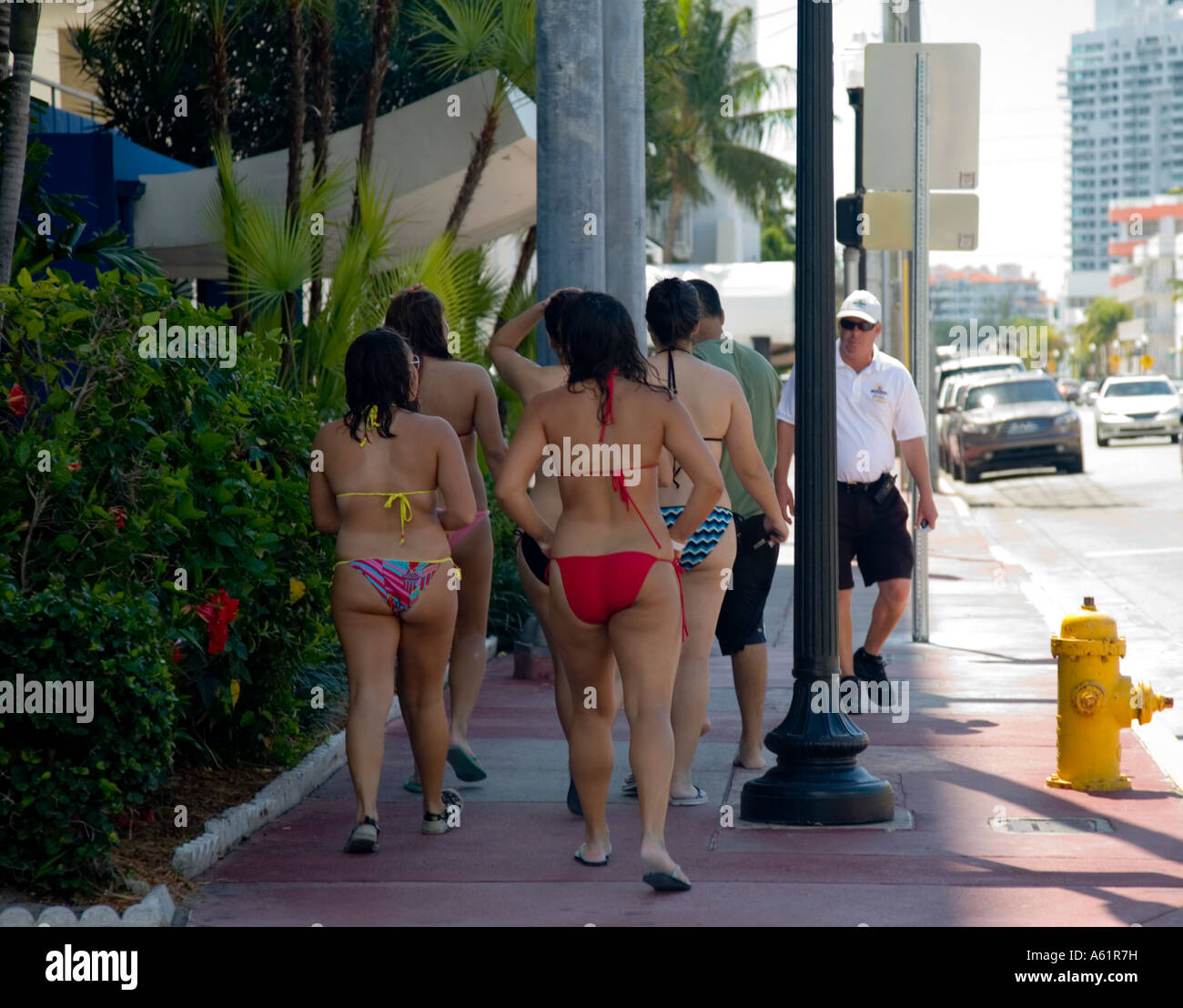 USA Florida Miami Beach with Hotels and sun worshipers bikini girls on  sidewalk in South Beach Miami Florida USA Stock Photo - Alamy