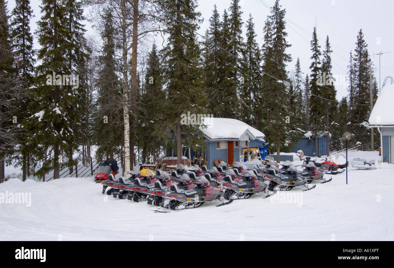 Parked snowmobiles at Luosto, Lapland, Northern Finland, Europe, Arctic Stock Photo