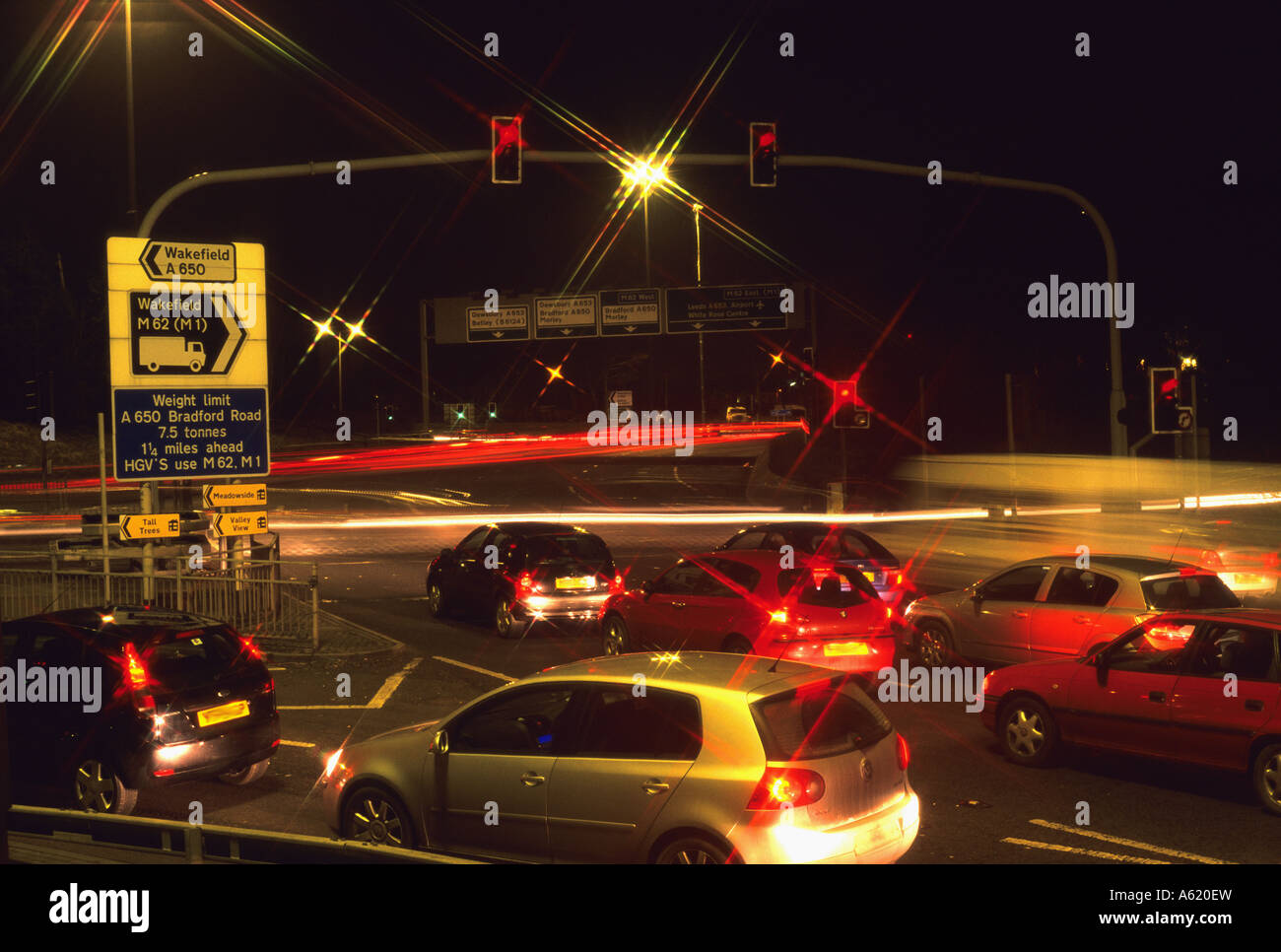 traffic stopped at red traffic light on transport interchange by the M62 motorway Leeds Yorkshire UK Stock Photo