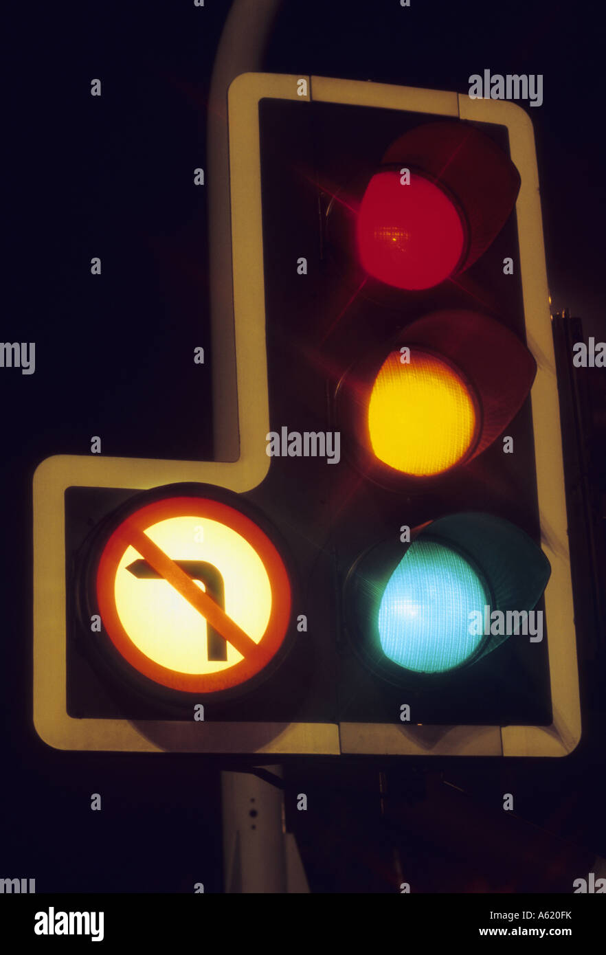 time exposure of traffic light showing red amber and green lights at night Leeds Yorkshire UK Stock Photo