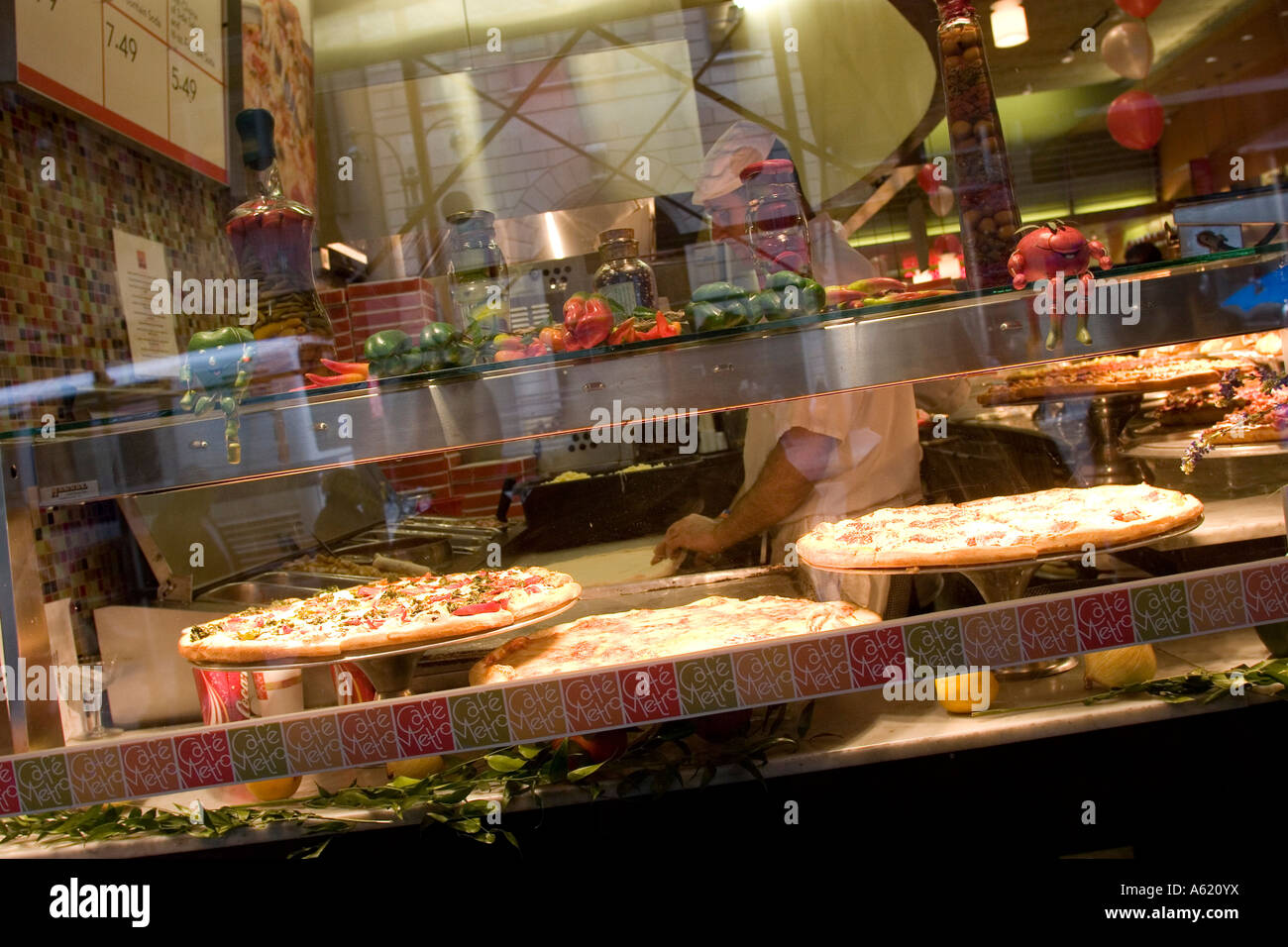 Pizza in pizzaria window New York NY USA Stock Photo