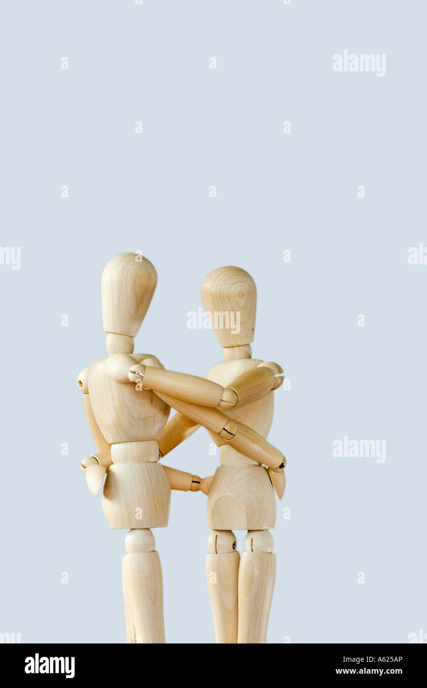 Concept two figures embrace hug cuddle Stock Photo