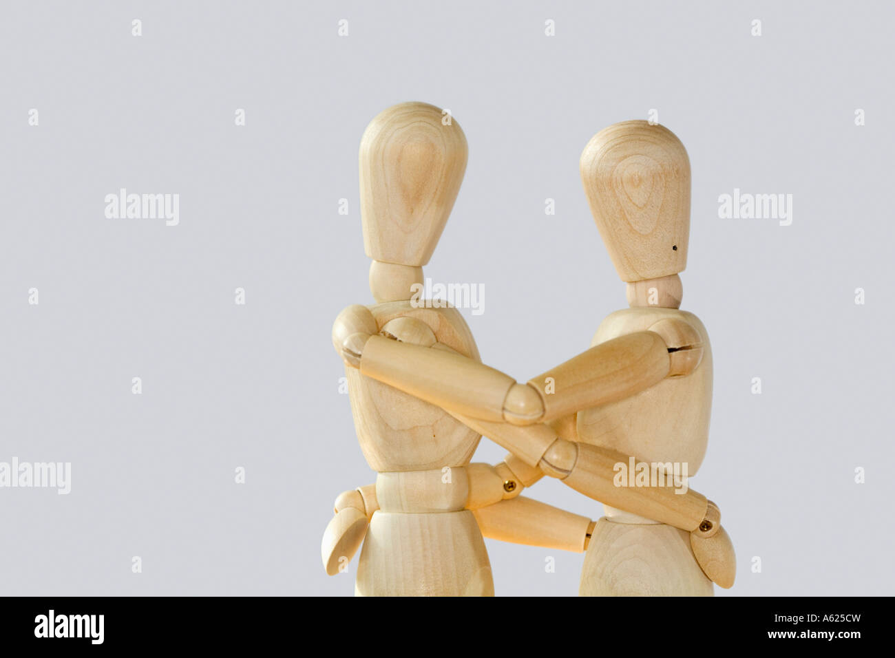 Concept two figures embrace hug cuddle Stock Photo