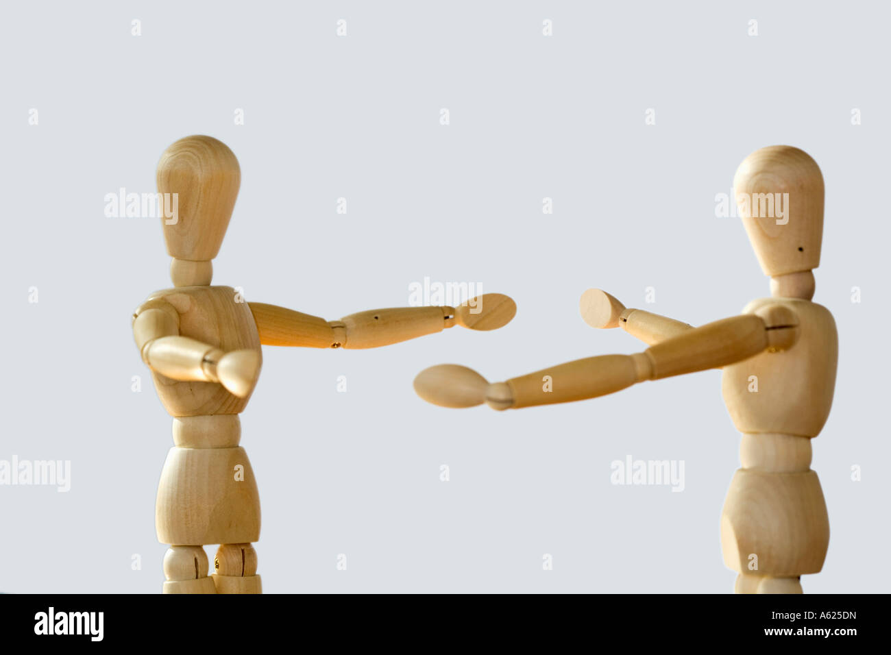 Concept two figures arms outstretched greeting meeting Stock Photo