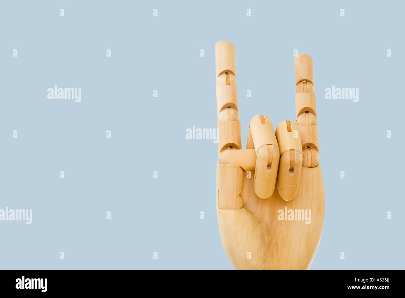 Wooden hand corna horned hand gesture Stock Photo - Alamy