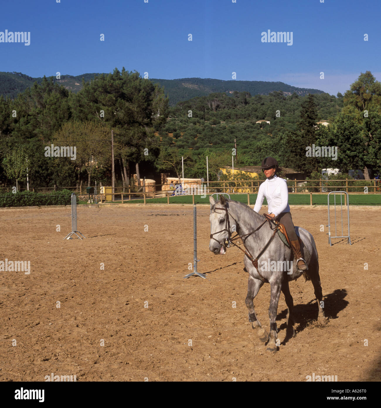 Young lady horse riding at Real Club Escuela Equitacion de Mallorca Bunyola  Mallorca Balearic Islands Spain 18th April 2004 Stock Photo - Alamy