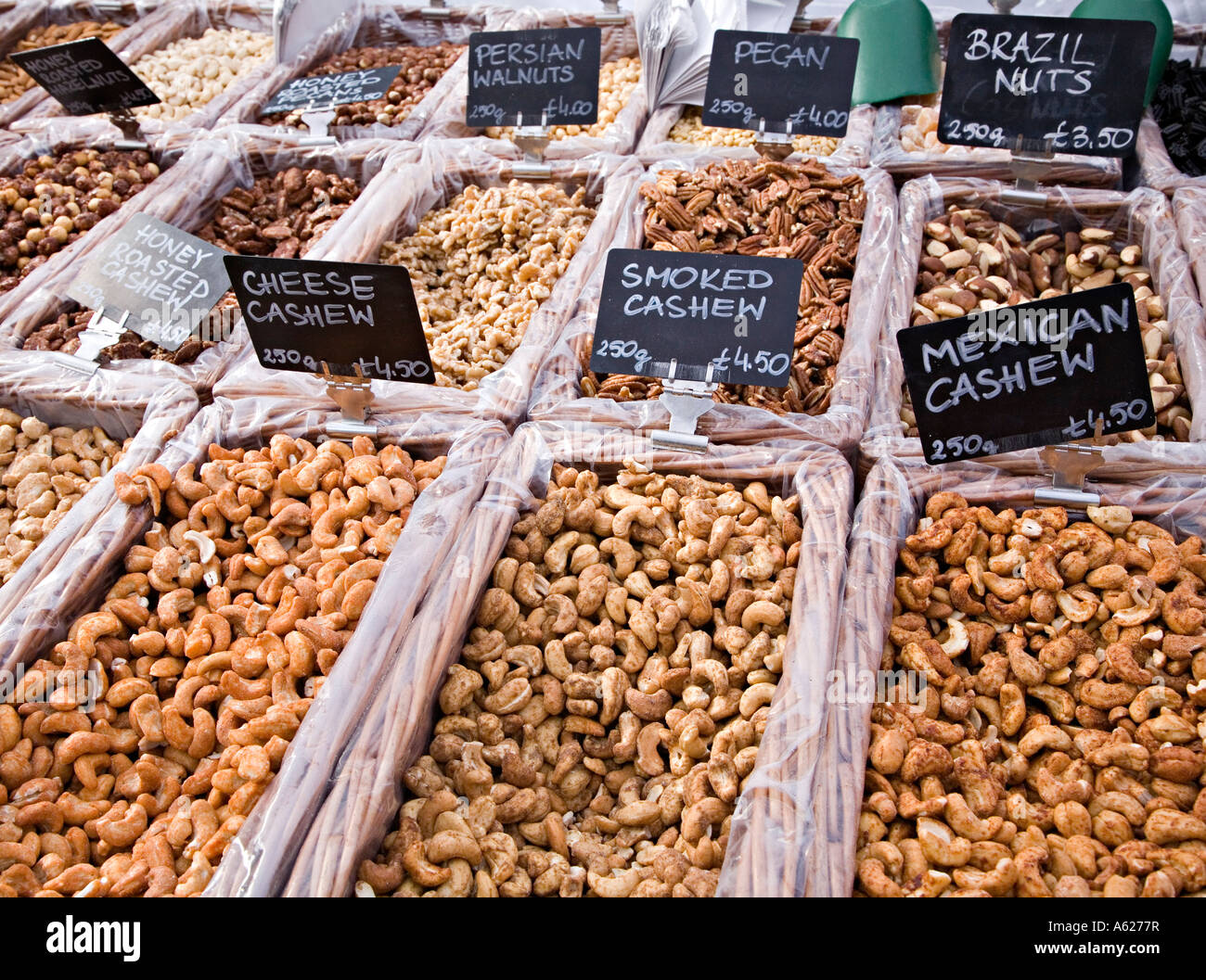 Differnt types of nut on sale at open air farmers market Wales UK Stock