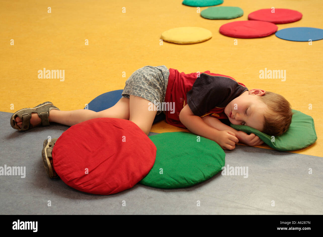 portrait of a little boy sleeping on the floor Stock Photo Alamy