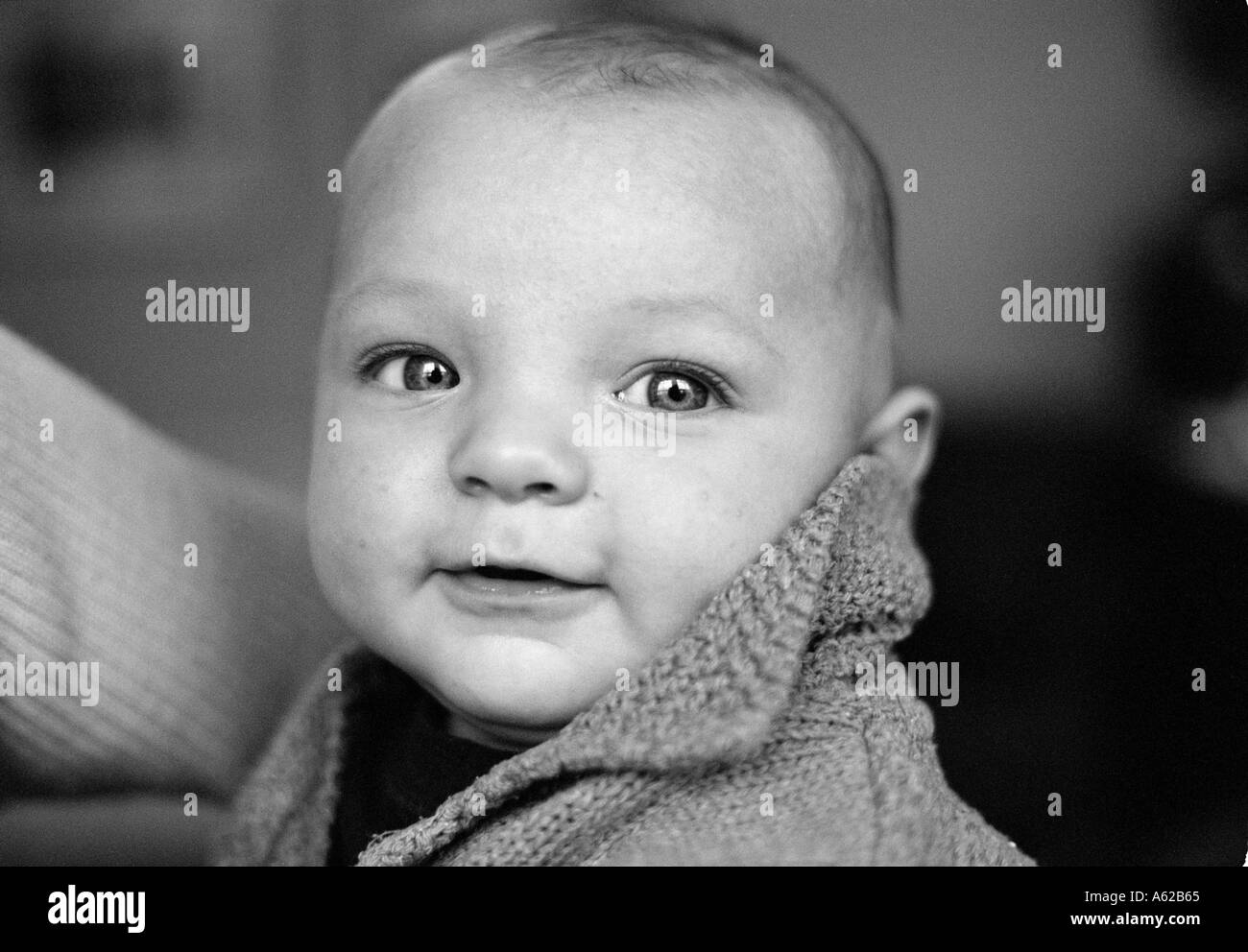 head and shoulder crop of baby with a high collar Stock Photo