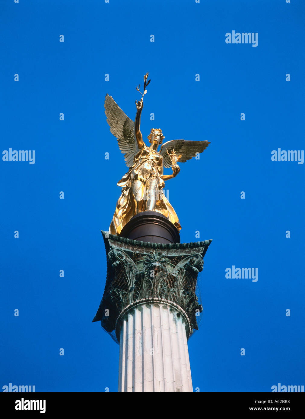 Low angle view of angel of peace statue against blue sky, Munich