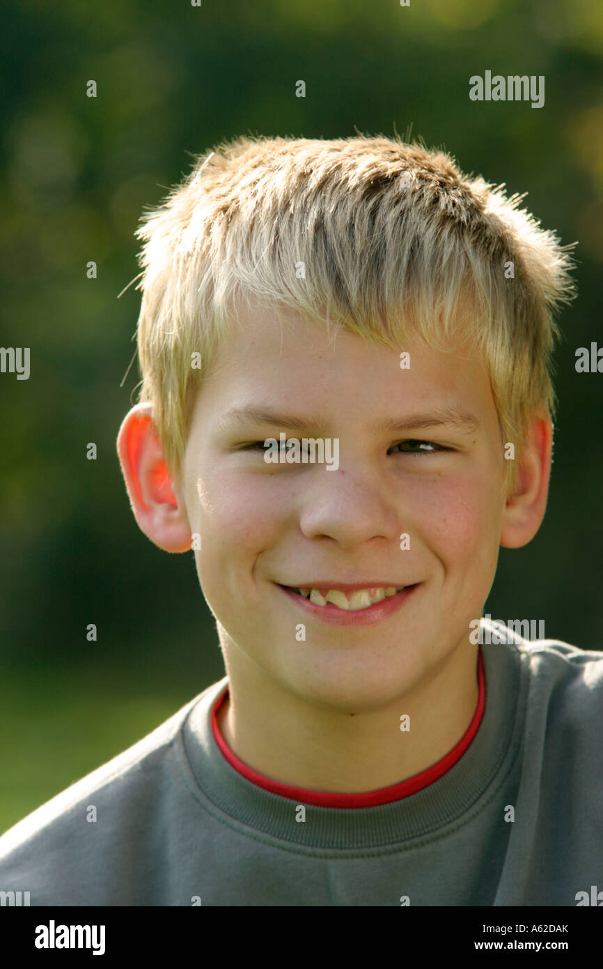 portrait of a smiling young boy with fair hair Stock Photo