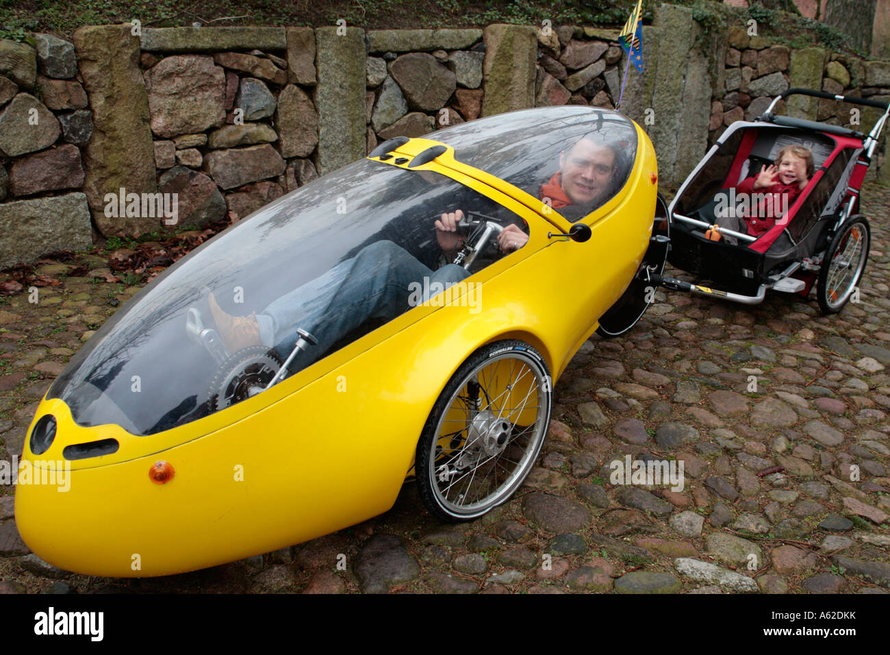 father and son travelling by an electric vehicle Stock Photo Alamy