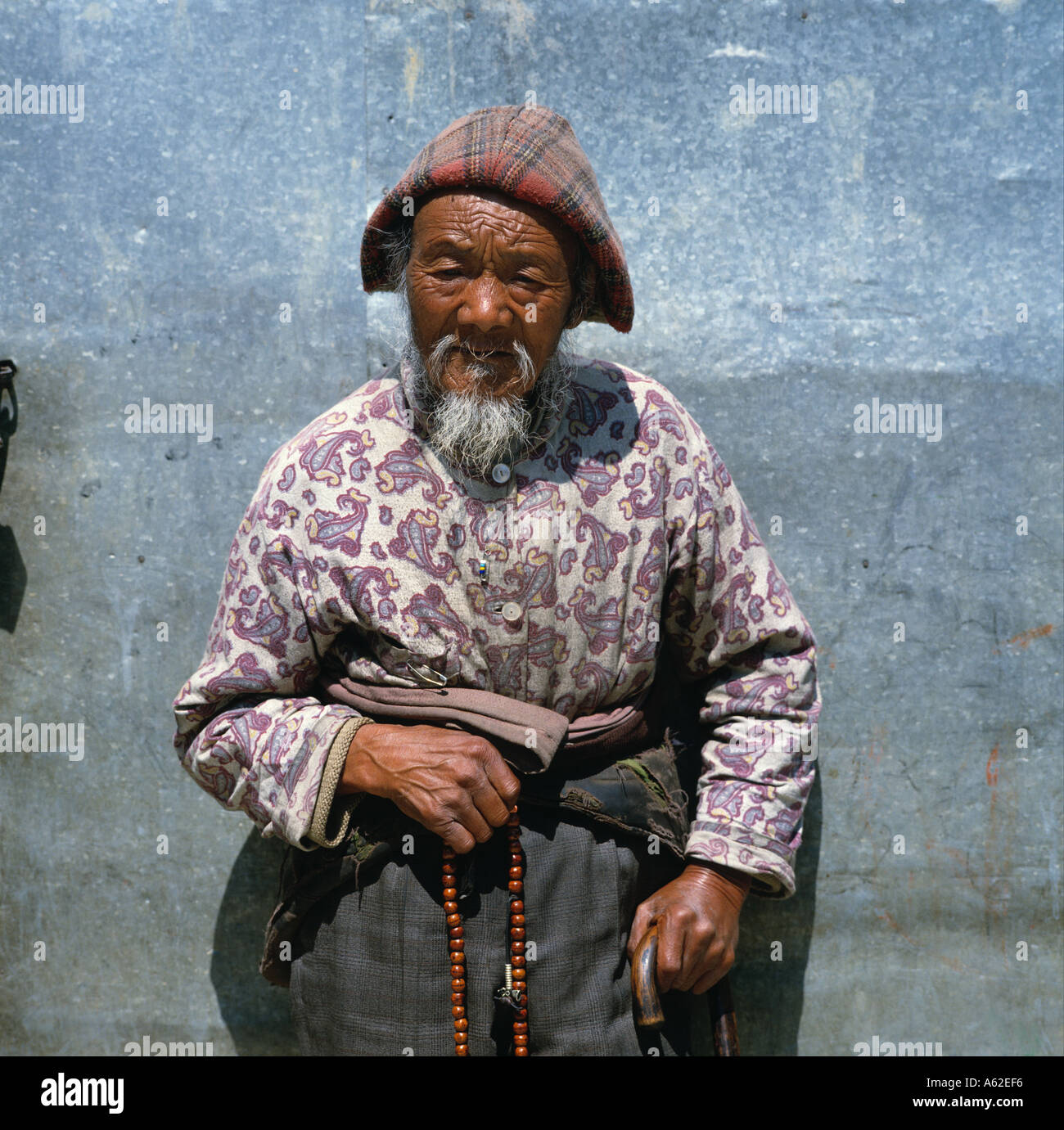 An old Tibetan man at the Tibetan centre in the town Stock Photo