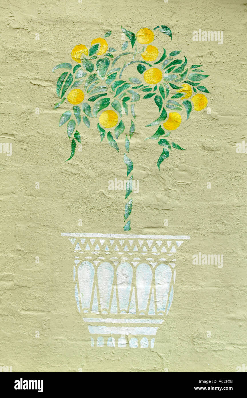 stencil of a lemon tree on a restaurant wall Stock Photo