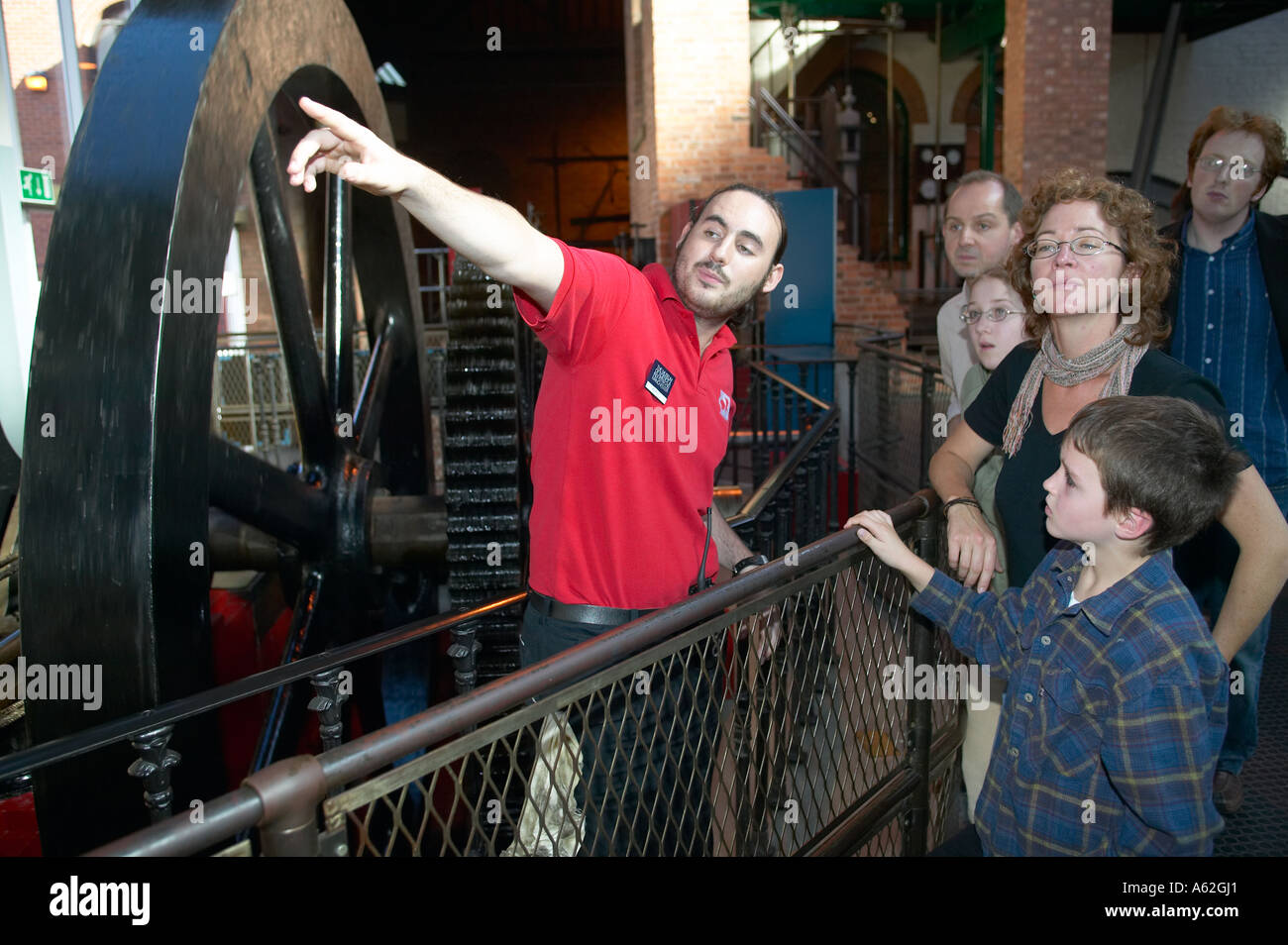 family exploring an industrial museum Stock Photo