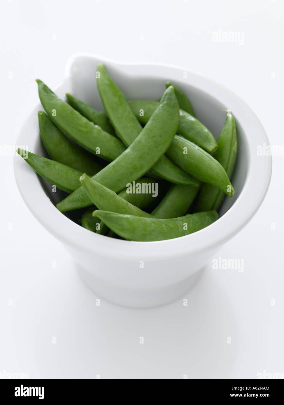 Sugar snap peas in white bowl shot with professional medium format digital camera Stock Photo