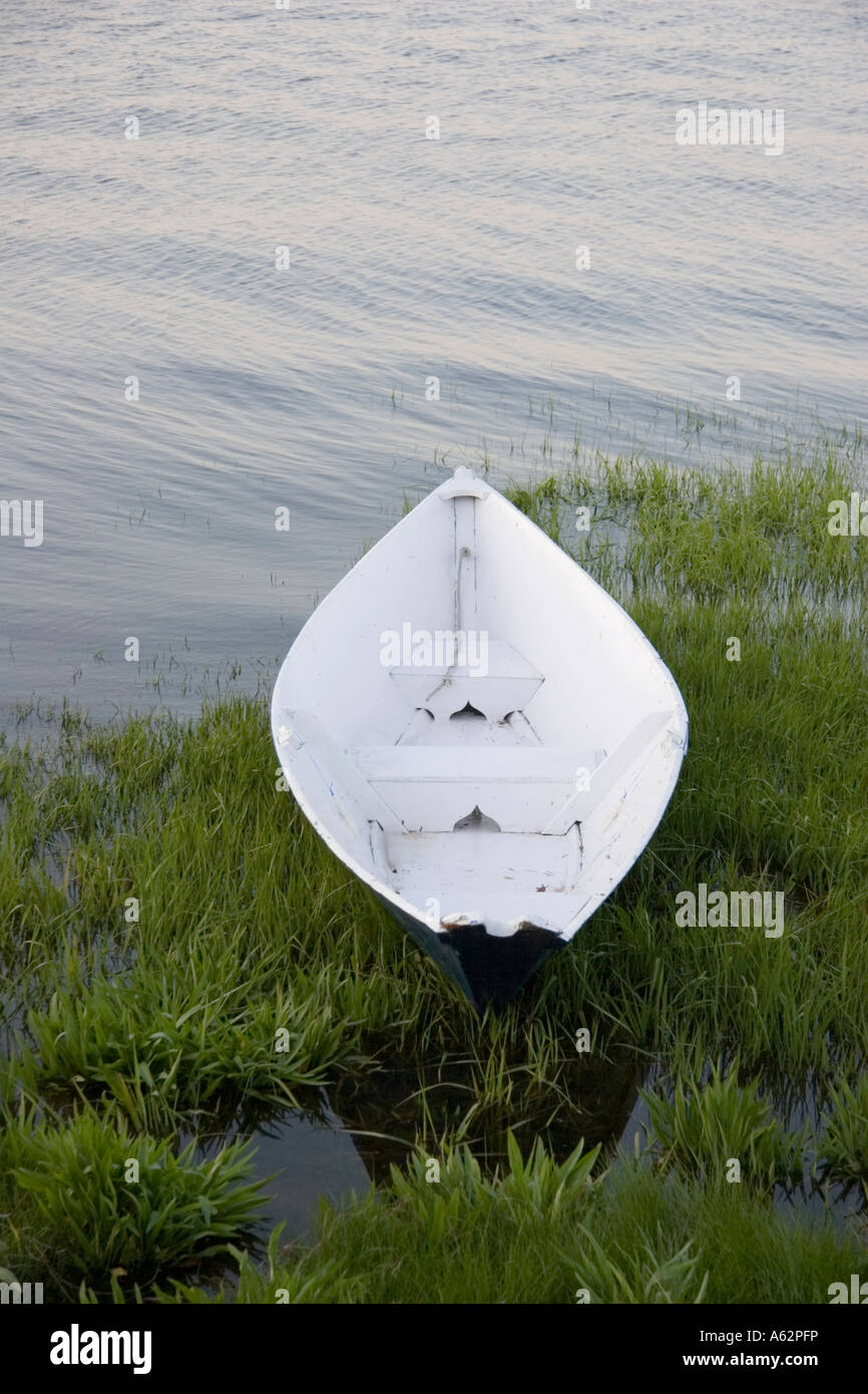 a rowboat siting on the shore of a bay in Newburyport ma usa Stock Photo