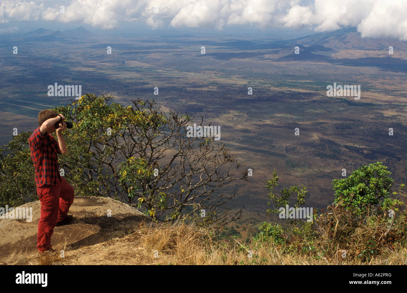 tourist photographing at Irente viewpoint Usambara Mountains outside Lushoto Tanzania Stock Photo