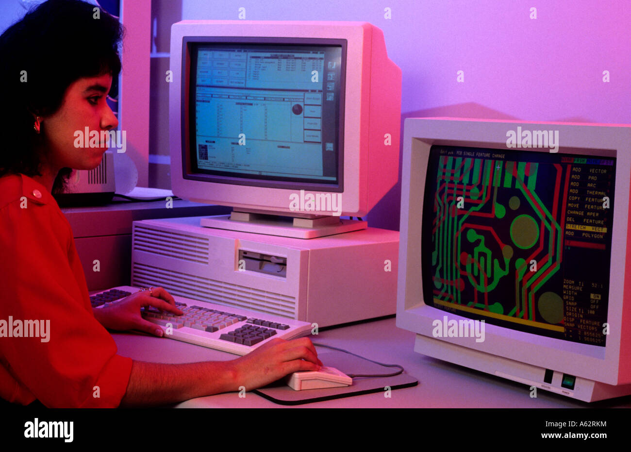 Hispanic woman in office working on hi tech circut design on computer Stock Photo