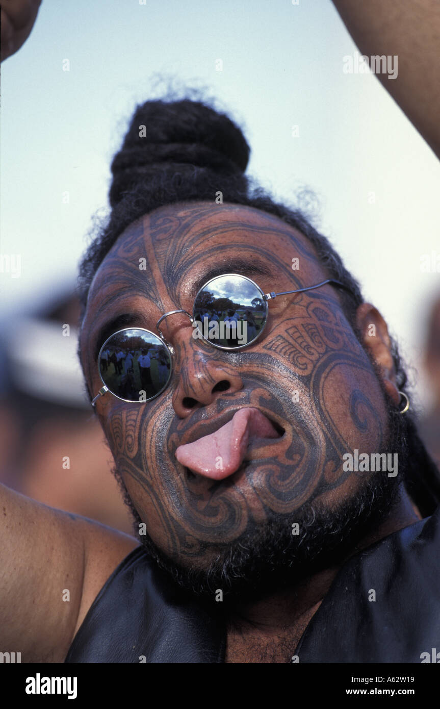 New Zealand Tatoo covered Maori protester makes warrior facial contortions at Waitangi Day celebrations  Stock Photo