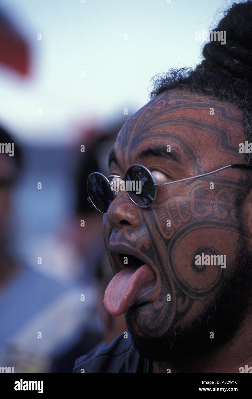 New Zealand Tatoo covered Maori protester makes warrior facial contortions at Waitangi Day celebrations  Stock Photo