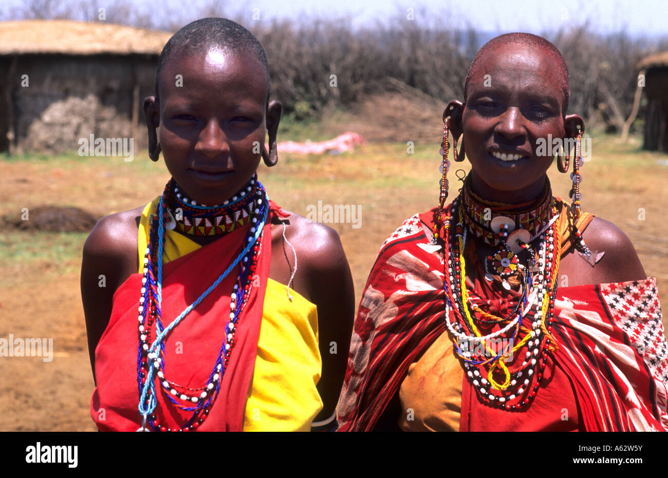 Maasai tribe dark women in costume traditional dress in jungles near Kenya Africa Stock Photo