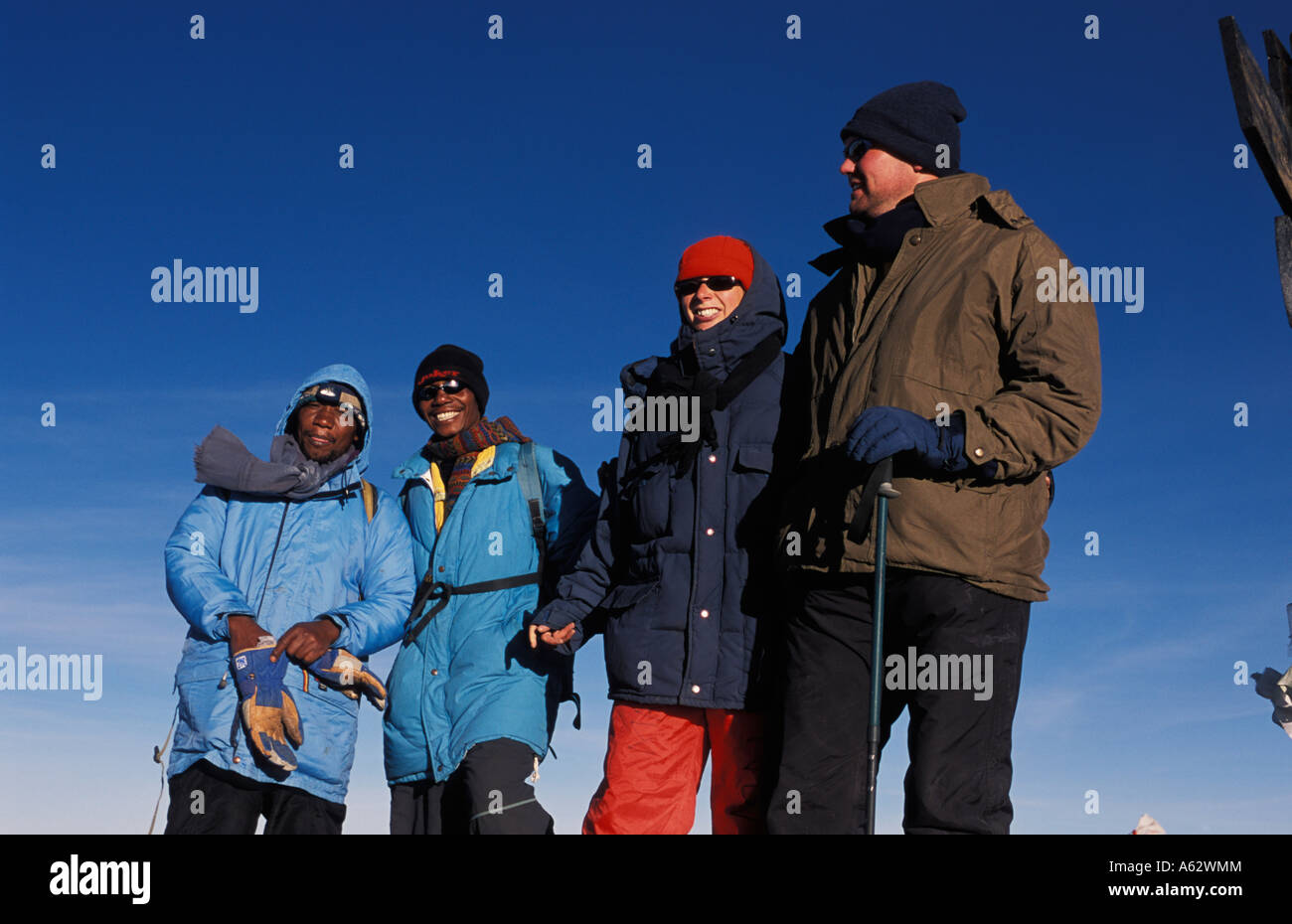Climbers on Uhuru peak 5895m the summit of Mount Kilimanjaro Kilimanjaro National Park Tanzania Stock Photo