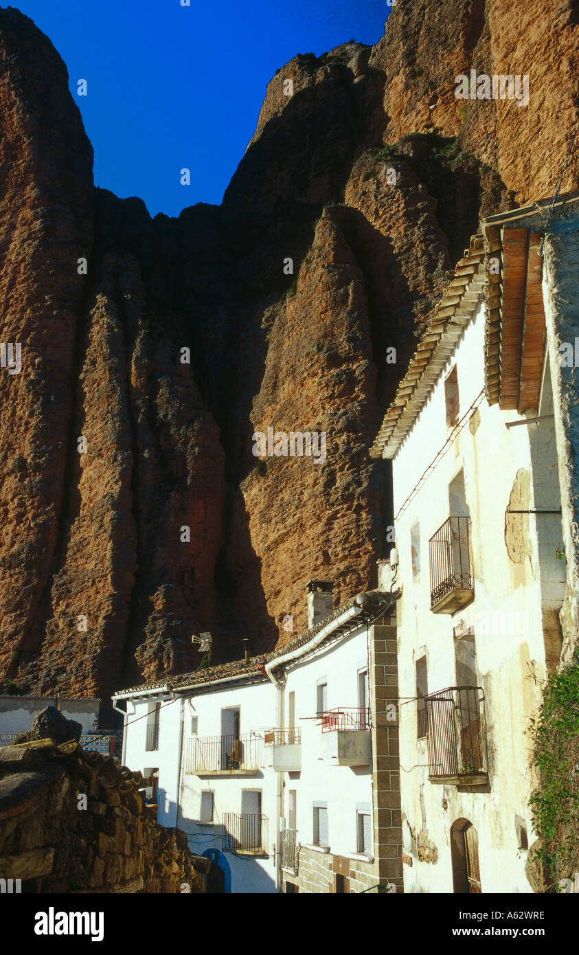 Buildings on foot of mountain, Los Mallos De Riglos, Pyrenees, Huesca, Aragon, France Stock Photo