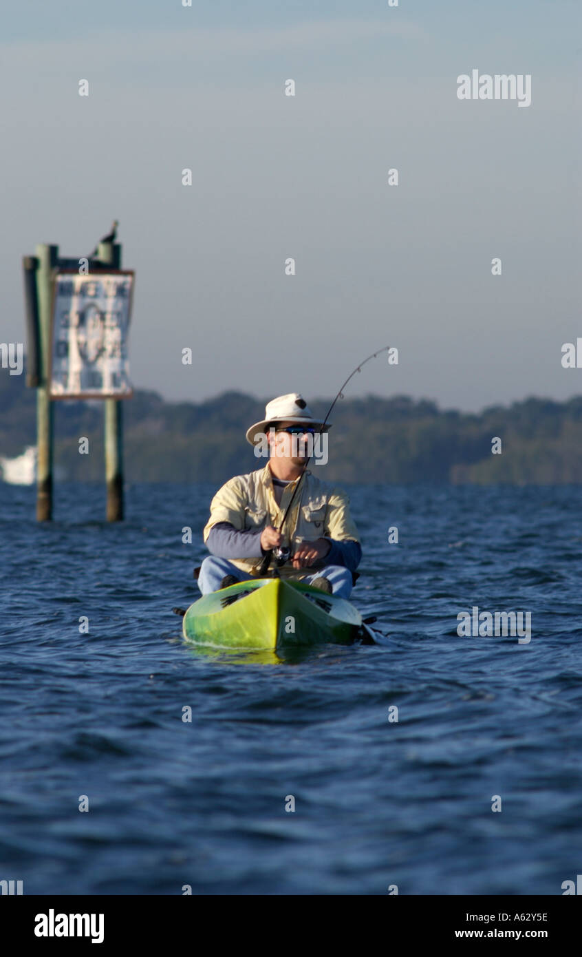 Man fishing from kayak Intracoastal waterway Indian River Lagoon Stuart
