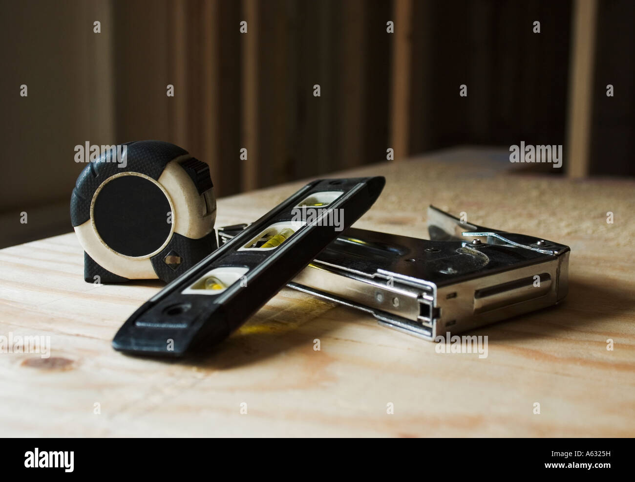 Tape measure staple gun and level Stock Photo Alamy