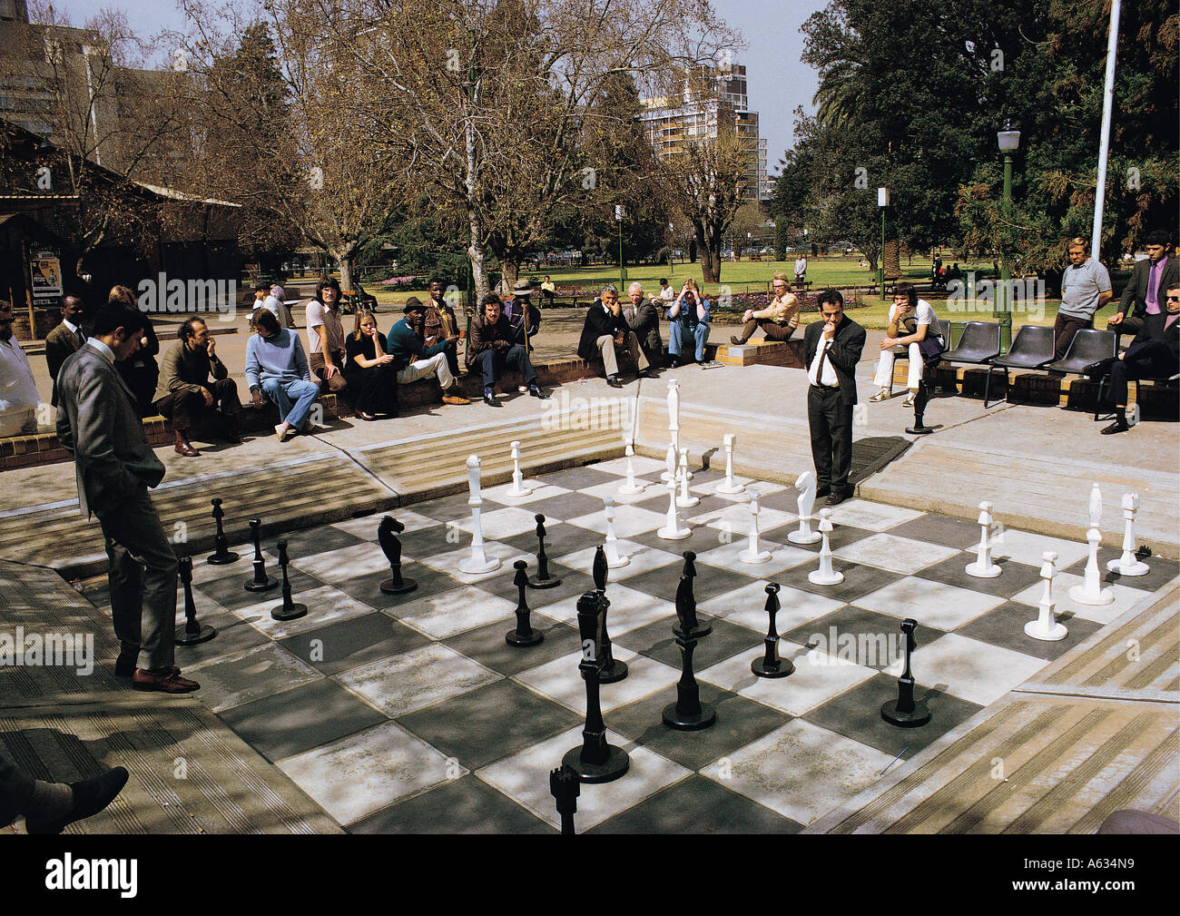 Playing chess on giant chess set in Joubert Park in Johannesburg South  Africa Mixed race people look on Stock Photo - Alamy