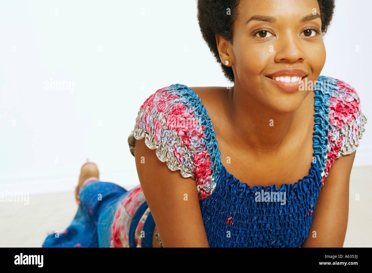 Portrait of a young woman smiling and lying down Stock Photo