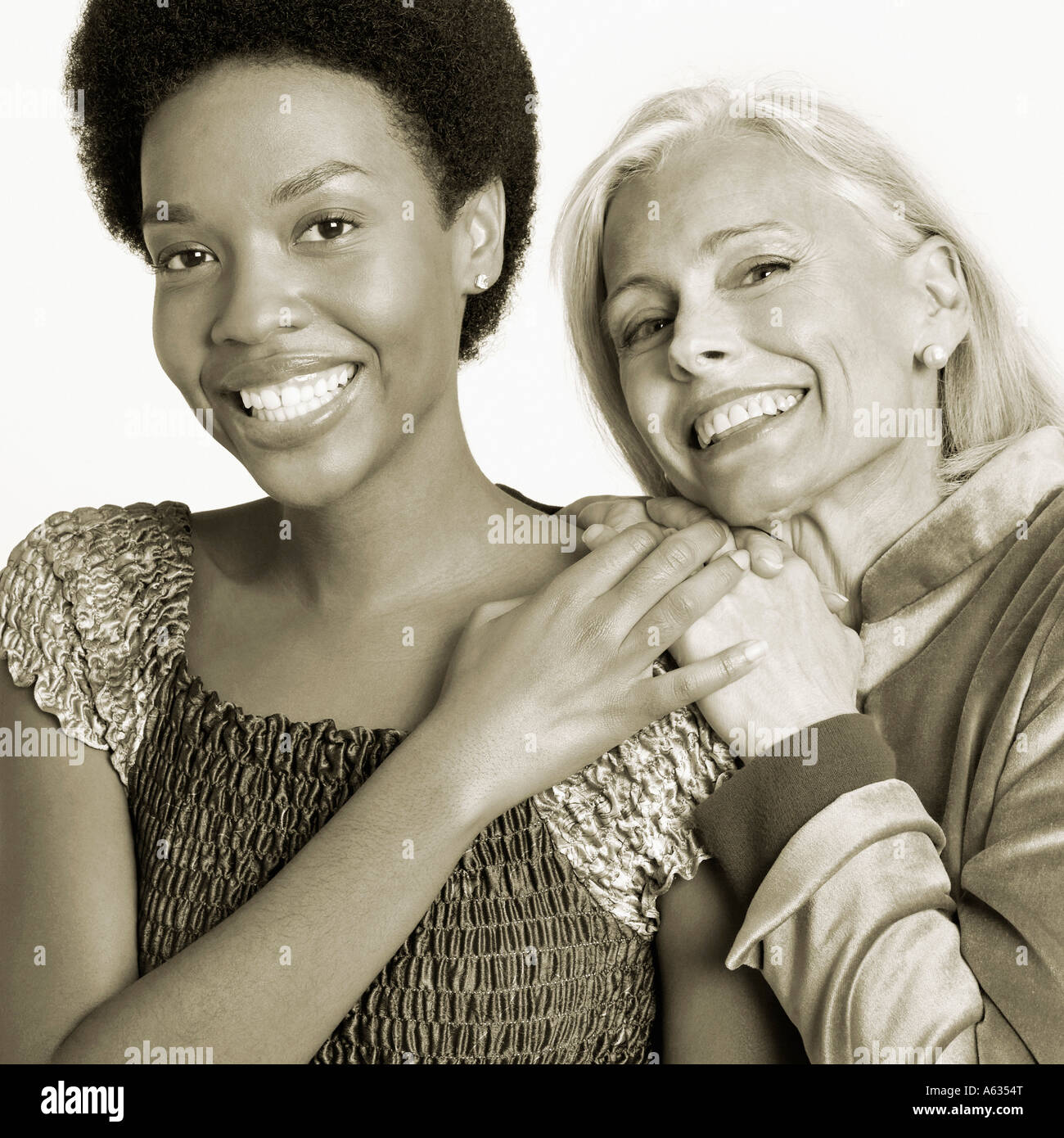 Portrait of a young woman and a senior woman smiling Stock Photo